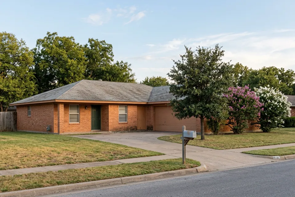Illustration of a 1970s brick ranch house with a two-car garage