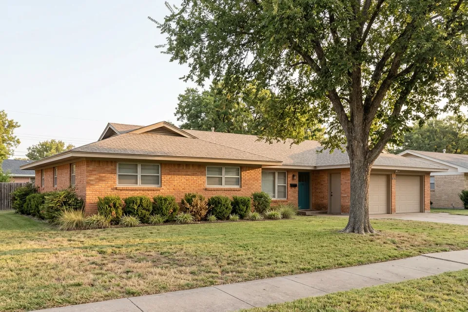 Illustration of a 1970s brick ranch house with a two-car garage