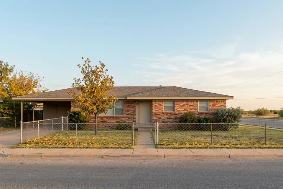 Illustration of a small 1950s brick ranch house