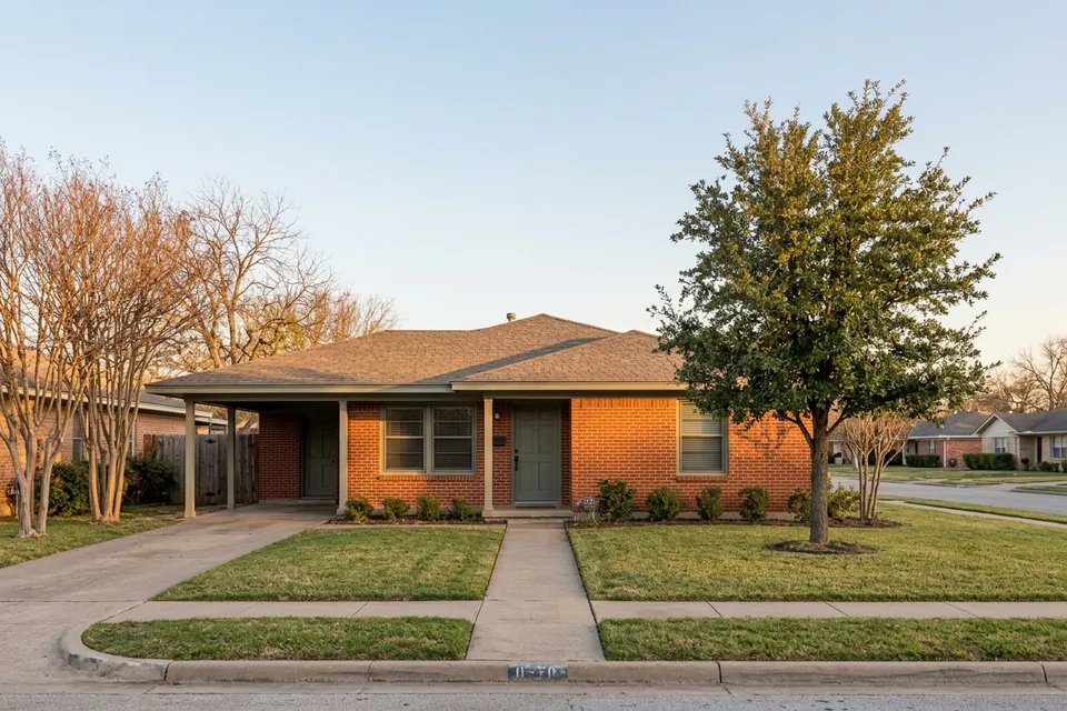 Illustration of a 1960s red brick ranch house with a carport