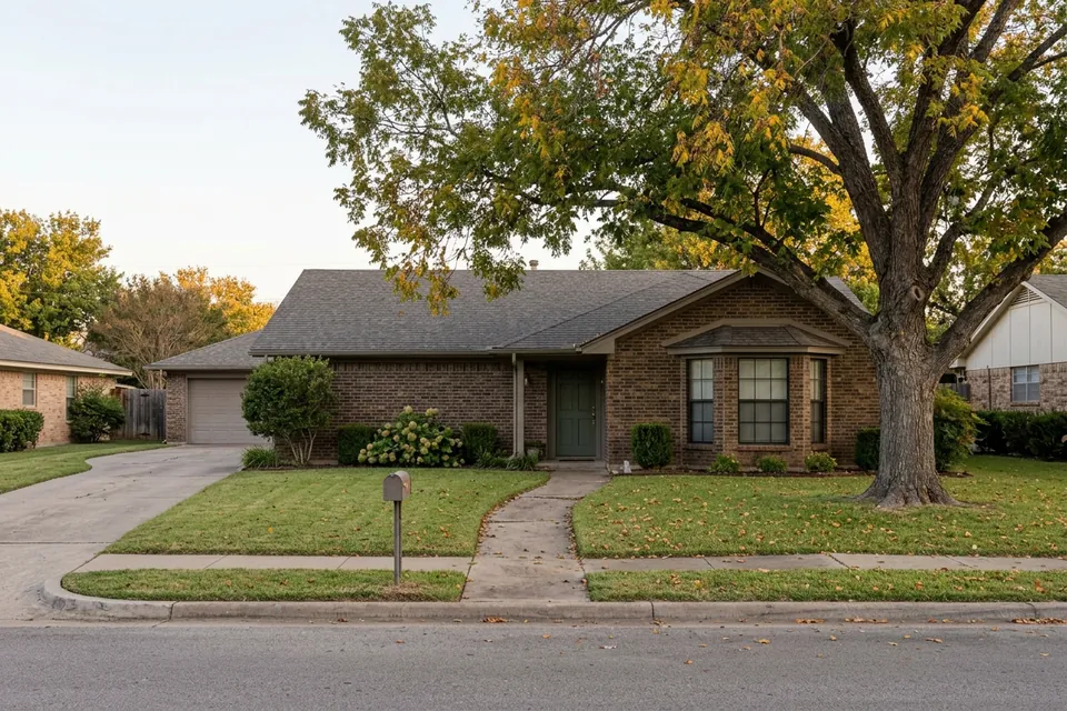 Illustration of a 1980s brown brick ranch house with a bay window