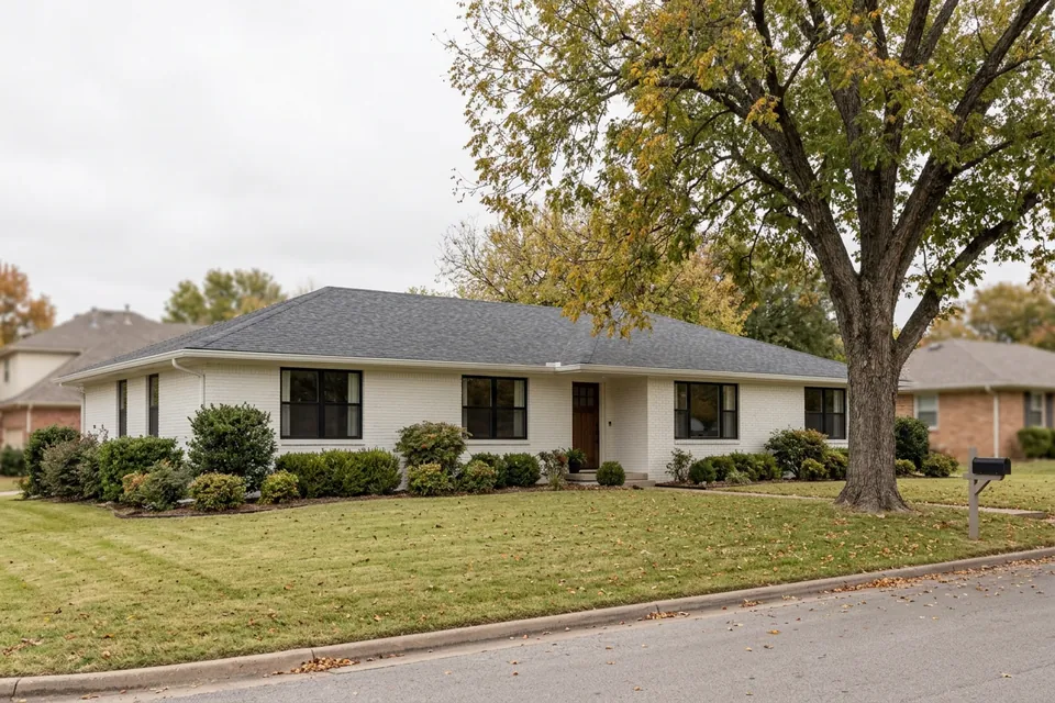 Illustration of a 1970s white-painted brick ranch house