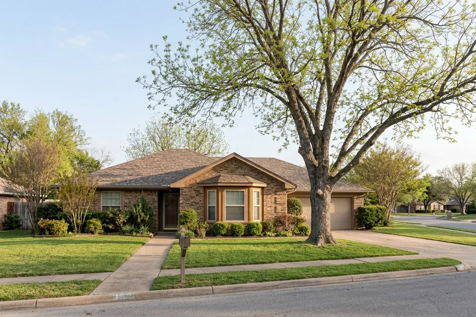 Illustration of a 1980s brown brick ranch house with a bay window