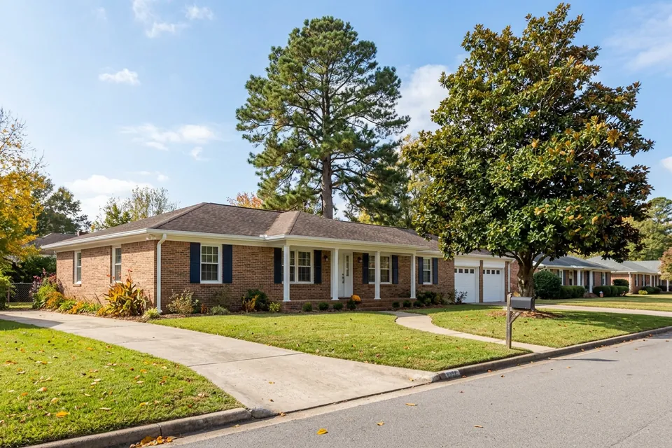 Illustration of a 1970s brick ranch house with shutters