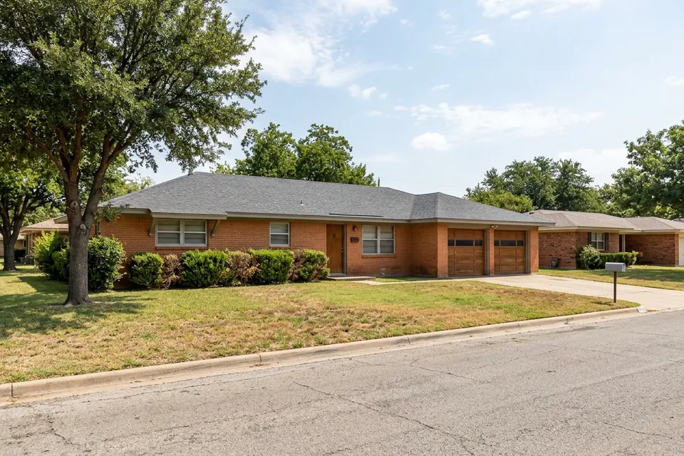 Illustration of a 1970s brick ranch house with a two-car garage