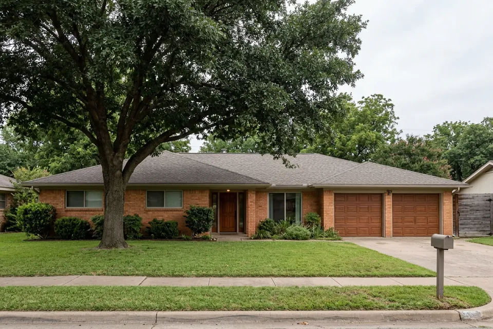 Illustration of a 1970s brick ranch house with a two-car garage