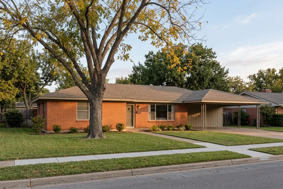 Illustration of a 1960s red brick ranch house with a carport